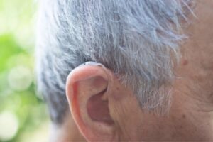 A detailed view of an elderly ear highlighting Hearing Aid care in Naples & Estero, FL
