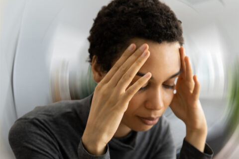 A women is having a headache in Naples and Estero, FL