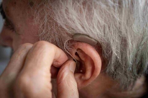 Close-up of a new hearing aid being adjusted